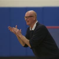<p>Brewster coach Tom Nelligan cheers on his team.</p>