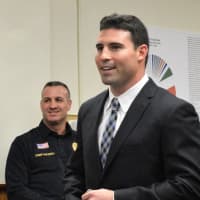 <p>New Emerson Patrol Officer Trace McDermott as Chief Michael Mazzeo looks on.</p>