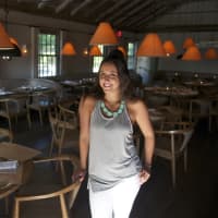 <p>Restaurant host Sara Katritos shows off one of the restaurant&#x27;s dining rooms.</p>