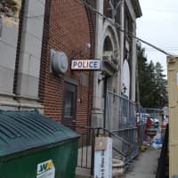 <p>The current Fairview police station and municipal buildings will come down to make room for a new parking lot. Police vehicles are currently parked on a side street.</p>