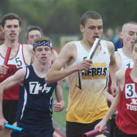 <p>Runners compete in the boys 4x400 Friday at the Joe Wynne Somers Lions Club Track &amp; Field Invitational.</p>