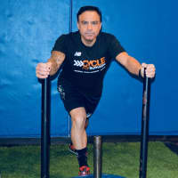 <p>Paramus Deputy Chief Robert Guidetti pushes a weighted sled across the gym early Thursday morning.</p>
