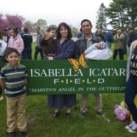 <p>The Icatar family (from left): Nathaniel, 8; Giancarlo, 2; parents Julianne and Roniel; Xavier, 3 months; and Annalise, 16, stand with the sign that bears Isabella&#x27;s name at Saturday&#x27;s dedication ceremony.</p>