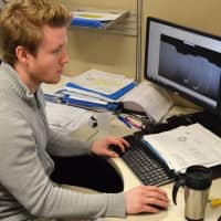 <p>Phil Vierno of Cresskill, associate manufacturing engineer, works on a design.</p>