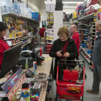 <p>Customers shop in the newly reopened William Tell True Value Hardware store in Hopewell.</p>