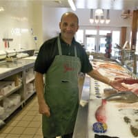 <p>Gus&#x27;s Peter Kissel shows off the fresh seafood selection at Gus&#x27;s.</p>