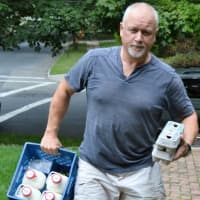 <p>Christian Singleton, warehouse manager for Organic Milk Corp, making a delivery.</p>