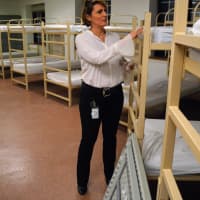 <p>Julia Orlando, director of the Bergen County Housing, Health and Human Services Center, in one sleeping area of the center&#x27;s homeless shelter. Each bed is equipped with mattress materials that prevent bed bugs.</p>