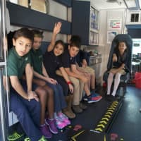 <p>Kids from the Side by Side School get a tour of an ambulance as part of EMS Services Week.</p>