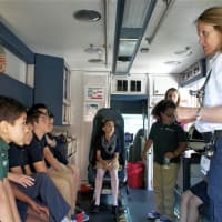 <p>Kids from the Side by Side School in Norwalk get a tour of an ambulance as part of EMS Services Week.</p>
