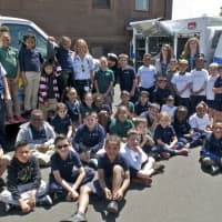 <p>Kids from the Side by Side School in Norwalk enjoy their visit from EMTs as part of EMS Services Week.</p>