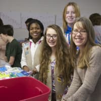 <p>Volunteers prepare items Friday night in Carmel to ship to soldiers overseas.</p>