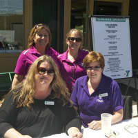 <p>Staffers at the registration table at the Regional YMCA of Western Connecticut 27th annual Golf Classic recently at the Richter Park Golf Course in Danbury.</p>