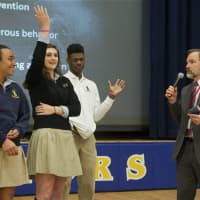 <p>Josh Feldman, founder of End Distracted Driving, does a distracted driving demonstration with students from Our Lady of Lourdes HS Tuesday morning.</p>