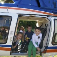 <p>Kids check out the view from the emergency helicopter.</p>
