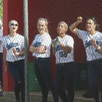 <p>The Suffern dugout cheers for teammates.</p>