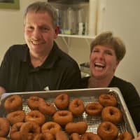 <p>Glazed Over Donuts owners Ron and Lisa Tompkins have had their hands full since opening on Thursday.</p>