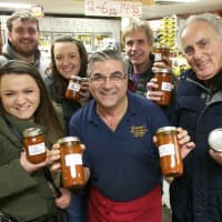 <p>Vinny Lamorte (center) and happy customers with his new Fra Diavolo Marinara Sauce.</p>