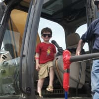 <p>Kids check out emergency vehicles, motorcycles and the big rigs at Saturday&#x27;s Barnum Festival Touch-A-Truck event in Fairfield.</p>