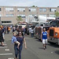 <p>The parking lots is filled with emergency vehicles, motorcycles and the big rigs at Saturday&#x27;s Barnum Festival Touch-A-Truck event at Fairfield Ludlowe High School.</p>