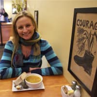 <p>General Manager Melissa Beck with a cup of Thai Red Lentil soup with sourdough miche.</p>
