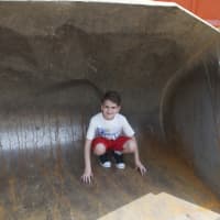 <p>A boy checks out the bucket of a bulldozer at Saturday&#x27;s event.</p>