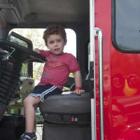 <p>Kids climb on the emergency vehicles, motorcycles and the big rigs at Saturday&#x27;s Barnum Festival Touch-A-Truck event.</p>