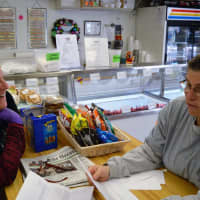 <p>Tami Moses, right, and Theresa Brown of Clifton enjoy fan mail from kids who like to come to the Whistle Stop. They&#x27;ve been friends for 30 years.</p>