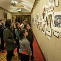 <p>Visitors check out the student artwork at Sunday&#x27;s reception.</p>