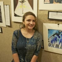 <p>Madison Delelle of Stamford High School stands next to her artwork at Sunday&#x27;s reception for students at the Sackler Art Gallery at Stamford&#x27;s Palace Theatre.</p>
