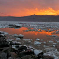 <p>A dramatic sunset reflects off ice flows on the Hudson at the Poughkeepsie waterfront.</p>