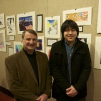 <p>Samuel Kim (right) of Stamford High, with her teacher Paul Cusano, next to Kim&#x27;s artwork (at right).</p>