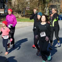 <p>Runners and walkers young and old race to the finish line during the South Salem Turkey Trot 5K Run/Walk.</p>