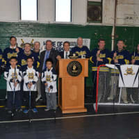 <p>Yonkers Mayor Mike Spano with the gear donated by the NHL Players&#x27; Association to help outfit the Yonkers Force hockey team.</p>