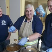 <p>One of the chili teams serves up the goods at Sunday&#x27;s event.</p>