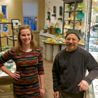 <p>Kaelyn Haggerty and owner Michael Benzer at Hudson Beach Glass.</p>