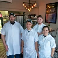 <p>Chef/owner Brian Arnoff with some of the staff from Kitchen Sink Food &amp; Drink.</p>