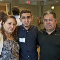 <p>Port Chester High&#x27;s Steven Hernandez, a Steer graduate and honoree, with parents Maria and Adan.</p>