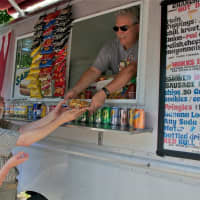 <p>Sal and Tina Celona have worked the truck for 25 years, and their specialty is hot dogs, and their own home style chili and onions.</p>