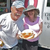 <p>Happy regulars with hot dogs from Charchael&#x27;s.</p>