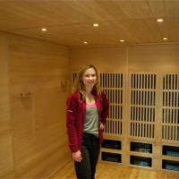 <p>Schneider shows off the new Hot Box sauna at enerShe Fitness.</p>