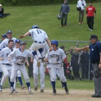 <p>Mahopac&#x27;s Anthony Mirditaj (11) scores the winning run in the bottom of the 10th as the Indians edge Ossining.</p>