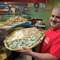 <p>Chef Gerardo Carino shows off some of the variety at Pizzeria Bacio.</p>