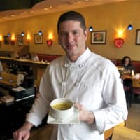<p>Crew Owner Thomas Kacherski with one of his housemade soups.</p>