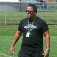 <p>Yorktown High coach Mike Rescigno works with players at a recent practice.</p>