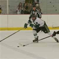 <p>A Pawling skater tries to get to the puck ahead of Brewster players.</p>