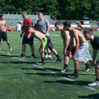 <p>Arlington players work out during a recent practice.</p>