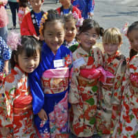 <p>Students from the Julian Curtiss School, representing 60 countries and speaking 30 languages, celebrate U.N. Day Thursday.</p>