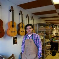 <p>Beacon&#x27;s John Vergara in his Lord of the Strings guitar shop.</p>