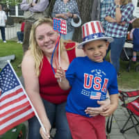<p>Flags and crowds line the streets in Bethel for the parade.</p>